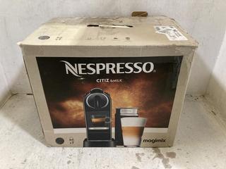 Lot 1009  
            Chesterfield SR44 - Parcel Delivery Only 

                
NESPRESSO CITIZ AND MILK MAGIMIX COFFEE MACHINE (LOCATION: C6)