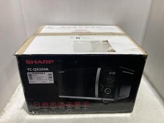 Lot 1487  
            Chesterfield SR44 - Parcel Delivery Only 

                
SHARP YC-QS204A MIRCOWAVE OVEN WITH FLATBED (LOCATION: A2)
