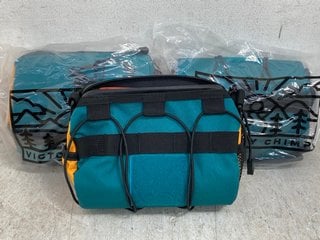 Lot 400  
            Marchington SR12 - Parcel Delivery Only 

                
3 X VICTORIA CHIMP OUT THERE BAR BAG IN TEAL/OCHRE - COMBINED RRP: £135.00: LOCAT...