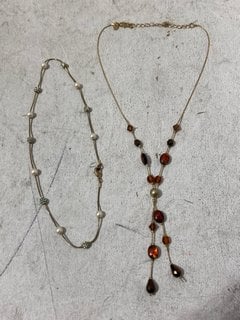 Lot 1268  
            Marchington SR11 - Parcel Delivery Only 

                
2 X GOLD COLOURED PENDANTS AND CHAINS IN A VELVET BAG: LOCATION - BR11