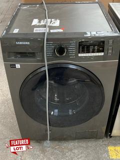 Lot 213  
            Marchington SR16 - Delivery or Collection 

                
SAMSUNG WD80TA046BK WASHING MACHINE IN GRAPHITE - ORIGINAL RRP:£479: LOCATION - A5