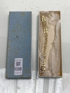 Lot 1338  
            Marchington SR13 - Parcel Delivery Only 

                
A GOLD COLOURED BRACELET SET WITH CLEAR STONES INN A VINTAGE BOX: LOCATION - C4