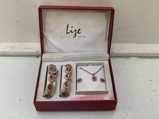 Lot 1455  
            Marchington SR13 - Parcel Delivery Only 

                
A LIZE BOXED COLLECTION COMPRISING WRISTWATCH, BRACELET, NECKLACE AND EARRINGS: L...