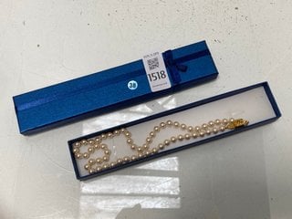 Lot 1518  
            Marchington SR13 - Parcel Delivery Only 

                
A STRING OF MONET VINTAGE FAUX PEARLS WITH A GOLD CLASP, BOXED: LOCATION - C1