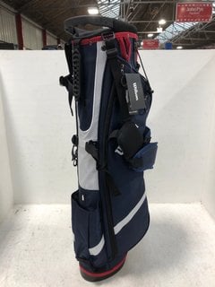 Lot 895  
            Marchington SR13 - Parcel Delivery Only 
                
WILSON QS GOLF BAG IN NAVY/RED/WHITE-ORIGINAL RRP £99.95: LOCATION - B15