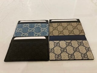 Lot 50  
            Nottingham SR6 - Parcel Delivery 
                
4 X GUCCI SIGNATURE PRINT CARD HOLDERS