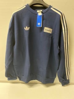 Lot 577  
            Nottingham SR6 - Parcel Delivery 
                
ADIDAS ORIGINALS 'OASIS' BLUE JUMPER (SIZE M)