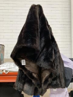 Lot 165  
            Chesterfield SR39 - Parcel Delivery Only 
                
ASTRAKA FUR COAT IN BROWN SIZE M (LOCATION: B2R)