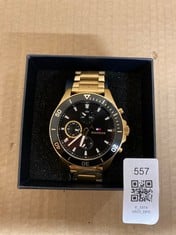 Lot 557  
            Edinburgh SR23 - Delivery Only 

                
TOMMY HILFIGER GOLD STAINLESS STEEL STRAP BLACK FACE MENS WATCH: LOCATION - D RACK