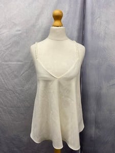 Lot 114  
            Edinburgh SR20 - Delivery Only 

                
DEREK LAM TANK TOP WITH BRAIDED STRAP DETAIL IN WHITE TRIACETATE, SIZE: 2, ORIGIN...