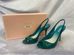 Lot 189  
            Edinburgh SR20 - Delivery Only 

                
MIU MIU OPEN TOE SLINGBACK HEELS IN TURQUOISE PATENT, SIZE:  36.5, ORIGINAL RRP £...
