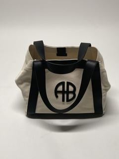 Lot 52  
            Birmingham Premium - Parcel Delivery Only 
                
ANINE BING CARA TOTE BAG COLOUR (NATURAL CANVAS WITH BLACK) ORIGINAL RRP £220