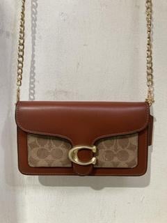 Lot 1039  
            Birmingham SR107 - Parcel Delivery Only 
                
COACH TABBY CHAIN CLUTCH WITH SIGNATURE CANVAS PURSE ORIGINAL RRP £325