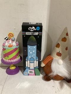 Lot 1046  
            Birmingham SR107 - Parcel Delivery Only 
                
3X ITEMS TO INCLUDE TINC ROCKET LAMP