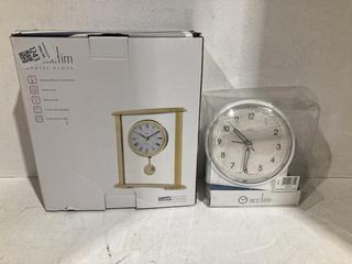 Lot 1243  
            Birmingham SR107 - Parcel Delivery Only 

                
2 X JOHN LEWIS & PARTNERS ITEMS TO INCLUDE ACCTIM BED SIDE ALARM CLOCK