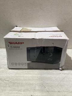 Lot 559  
            Birmingham SR107 - Parcel Delivery Only 

                
SHARP MICROWAVE YC-GG02