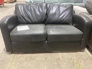 Lot 330  
            Birmingham SR106 - Collection or Optional Delivery Available 

                
DFS 2 SEATER SOFA IN BLACK LEATHER - LOA22ALOA - ORIGINAL RRP £1119 (LOCATION: A18)