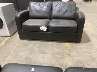 Lot 331  
            Birmingham SR106 - Collection or Optional Delivery Available 

                
DFS 2 SEATER SOFA IN BLACK LEATHER - LOA22ALOA - ORIGINAL RRP £1119 (LOCATION: A18)