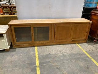 Lot 103  
            Birmingham - Collection Only 

                
LONG SIDEBOARD WITH GLASS AND WOODEN SLIDING FRONTS