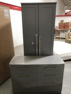 Lot 720  
            Chesterfield SR35 - Collection or Optional Delivery Available 

                
DFS 2 DOOR WARDROBE IN DARK GREY/GOLD TO INCLUDE MATCHING 6 DRAWER CHEST OF DRAWE...
