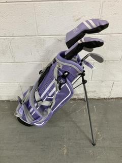 Lot 867  
            Chesterfield SR36 - Collection or Optional Delivery Available 

                
FAZER JUNIOR GOLF BAG IN LILAC/PURPLE WITH ASSORTED GOLF CLUBS (LOCATION: SR36 B6...