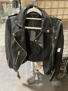 Lot 734  
            Chesterfield SR45 - Parcel Delivery Only 

                
ALLSAINTS BLACK LEATHER JACKET UK SIZE 8 (LOCATION: J8)