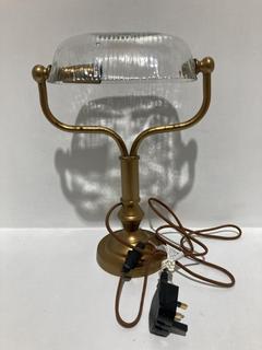 Lot 559  
            Chesterfield SR44 - Parcel Delivery Only 

                
NKUKU ULANI VINTAGE DESK LAMP IN ANTIQUE BRASS AND CLEAR (LOCATION: L12)