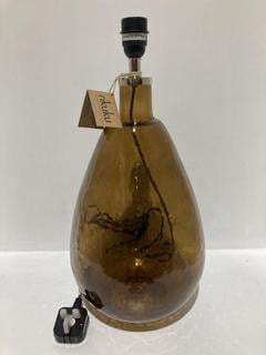 Lot 560  
            Chesterfield SR44 - Parcel Delivery Only 

                
NKUKU BABA RECYCLED GLASS LAMP - BURNT AMBER - LARGE TALL - ITEM NO. BL8301 - ORI...