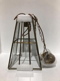 Lot 582  
            Chesterfield SR44 - Parcel Delivery Only 

                
NKUKU SOLAN GLASS LANTERN PENDANT - ANTIQUE BRASS & CLEAR - ITEM NO. SP5301 - ORI...