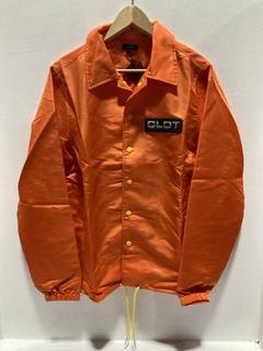 Lot 793  
            Chesterfield SR47 - Parcel Delivery Only 

                
CLOT ORANGE OBEY YOUR MASTER COACH JACKET IN MEDIUM ORIGINAL RRP £275. (LOCATION:...