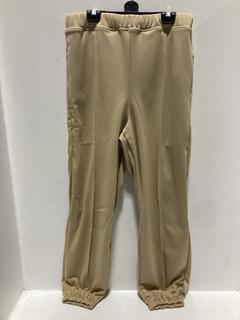 Lot 797  
            Chesterfield SR47 - Parcel Delivery Only 

                
RANDOM IDENTITIES ELASTIC PANTS IN BEIGE SIZE S ORIGINAL RRP £355. (LOCATION: H2)
