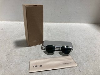 Lot 779  
            Marchington SR14 - Parcel Delivery Only 

                
CUBITTS AMPTON CLIP-ON SQUARE SUNGLASSES WITH 10ML CUBITTS LENS CLEANER: LOCATION...