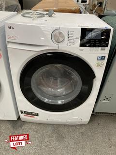Lot 46  
            Marchington SR18 - Delivery or Collection 
                
AEG 7000 SERIES PRO STEAM WASHER DRYER IN WHITE - MODEL: LFR71864B - ORIGINAL RRP...