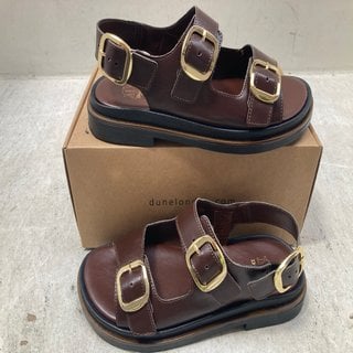 Lot 384  
            Marchington SR12 - Parcel Delivery Only 

                
DUNE LONDON 509 LUCKLES BROWN LEATHER TRIPLE BUCKLE CHUNKY SANDALS - UK SIZE: 6: ...