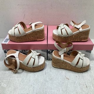 Lot 388  
            Marchington SR12 - Parcel Delivery Only 

                
2 X MODA IN PELLE WOVEN TWO PART WEDGE SANDAL IN OFF WHITE LEATHER - EU SIZE: 39 ...