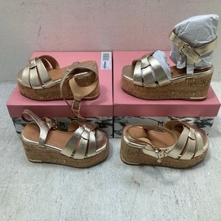 Lot 390  
            Marchington SR12 - Parcel Delivery Only 

                
2 X MODA IN PELLE WOVEN TWO PART WEDGE SANDAL IN CHAMPAGNE GOLD LEATHER - EU SIZE...