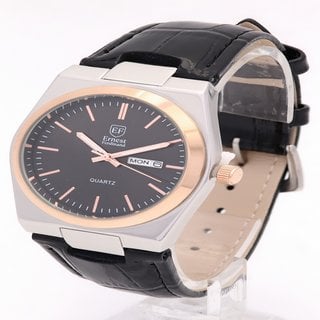 Lot 898  
            Marchington SR12 - Parcel Delivery Only 

                
ERNEST FERDINAND MEN'S WATCH. FEATURING A BLACK DIAL, GOLD COLOURED MARKERS AND H...