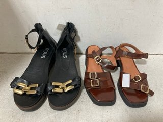 Lot 1214  
            Marchington SR10 - Parcel Delivery Only 

                
1 X PAIR OF HEELED SANDALS SIZE 37 AND 1 X PAIR OF MYUS SANDALS SIZE 6.5: LOCATIO...