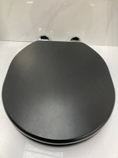 Lot 652  
            Marchington SR18 - Delivery or Collection 

                
SANEUX SOFIA OBSIDIAN BLACK SOFT CLOSED WOODEN W/C SEAT - ORIGINAL RRP £182: LOCA...