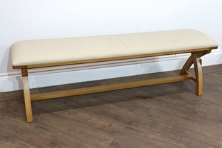 Lot 535  
            Marchington SR10 - Delivery or Collection 

                
CREAM LEATHER COUNTRY OAK CROSS LEG BENCH (SIZE 160CM L X 36CM W X 51CM H): LOCAT...
