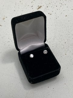 Lot 1036  
            Marchington SR13 - Parcel Delivery Only 

                
A PAIR OF EARRINGS SET WITH LARGE CLEAR STONES, BOXED: LOCATION - F3