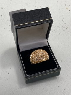 Lot 1055  
            Marchington SR13 - Parcel Delivery Only 

                
A LARGE GOLD COLOURED RING SET WITH CLEAR STONES, BOXED: LOCATION - F3