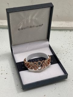 Lot 1069  
            Marchington SR13 - Parcel Delivery Only 

                
EQUILIBRIUM GOLD COLOURED BRACELET SET WITH CLEAR STONES, BOXED: LOCATION - F3