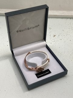 Lot 1074  
            Marchington SR13 - Parcel Delivery Only 

                
EQUILIBRIUM GOLD COLOURED BRACELET SET WITH CLEAR STONES, BOXED: LOCATION - F3