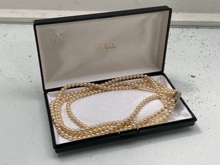 Lot 1104  
            Marchington SR13 - Parcel Delivery Only 

                
A QUADRUPLE STRAND OF VINTAGE SIMULATED PEARLS, BOXED: LOCATION - F2