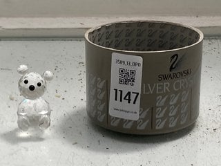 Lot 1147  
            Marchington SR13 - Parcel Delivery Only 

                
A BOXED SWAROVSKI CHRYSTAL SCULTPURE OF A TEDDY BEAR: LOCATION - F1