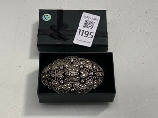 Lot 1195  
            Marchington SR13 - Parcel Delivery Only 

                
AN ANTIQUE SILVER COLOURED LARGE CELTIC STYLE BROOCH SET WITH CLEAR STONES, BOXED...