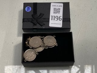 Lot 1196  
            Marchington SR13 - Parcel Delivery Only 

                
A COIN CHARM BRACELET MADE OF QEII SIXPENCES, BOXED: LOCATION - F1