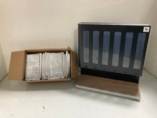 Lot 98  
            Marchington SR13 - Parcel Delivery Only 

                
NESPRESSO COFFEE POD HOLDER TO INCLUDE QTY OF 57.6 GRAMS FRAPPUCCINO ROAST SOLUBL...