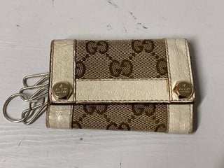 Lot 73  
            Nottingham SR3 - Delivery Only 
                
GUCCI GG CANVAS WALLET W KEY HOLDER